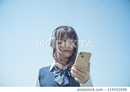 Headphones, smartphone and high school girl 114581696