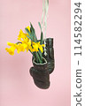 a pair of old boxing gloves hacked to become a vase 114582294