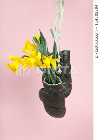 a pair of old boxing gloves hacked to become a vase 114582294