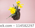 a pair of old boxing gloves hacked to become a vase 114582297