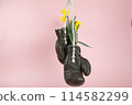 a pair of old boxing gloves hacked to become a vase 114582299