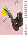 a pair of old boxing gloves hacked to become a vase 114582301