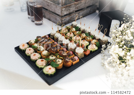 Small Canapes appetizers at the french wedding The Catering Small Canapes appetizers at the french wedding The Catering 114582472