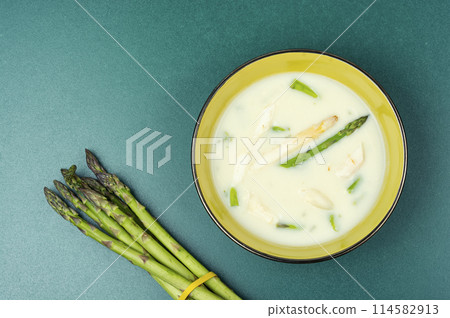 Bowl of asparagus soup. 114582913