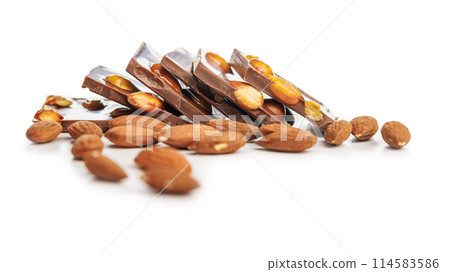 Broken chocolate bar with almonds isolated on white background. Broken chocolate bar with almonds isolated on white background. 114583586