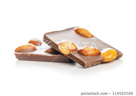 Broken chocolate bar with almonds isolated on white background. 114583589