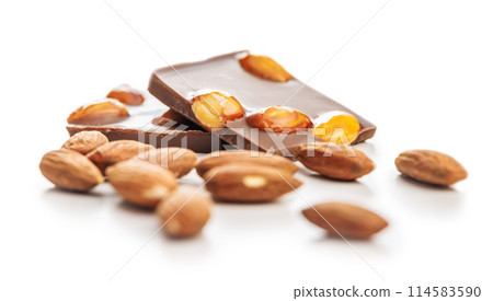 Broken chocolate bar with almonds isolated on white background. 114583590