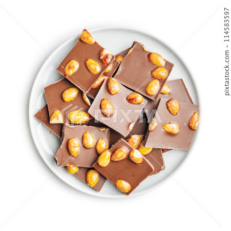 Broken chocolate bar with almonds on plate isolated on white background. Broken chocolate bar with almonds on plate isolated on white background. 114583597