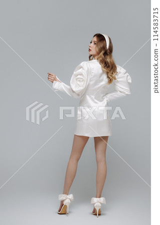 A woman in a white dress A woman in a white dress 114583715