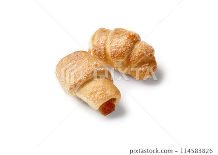 Two sugar sprinkled puff pastry mini turnovers with apple confiture Two sugar sprinkled puff pastry mini turnovers with apple confiture 114583826