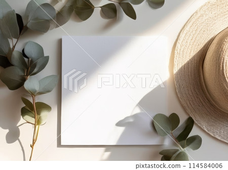 Flatlay with white empty sheet copy space for text, mock up. White greeting card of paper and cozy items background. Top view. Copy space for text or design 114584006