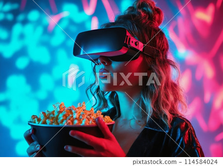 Millenial girl in vr-glass hold popcorn in neon lights. Young woman watching movie in vr-glass. 114584024