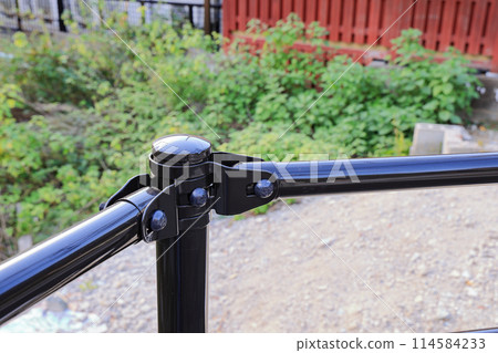 Steel fence along the walk way in the garden. 114584233