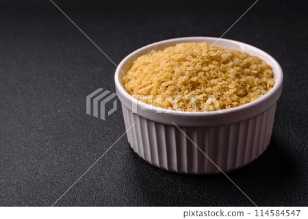 Raw stelline pasta from durum wheat with salt and spices Raw stelline pasta from durum wheat with salt and spices 114584547