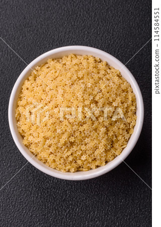 Raw stelline pasta from durum wheat with salt and spices Raw stelline pasta from durum wheat with salt and spices 114584551