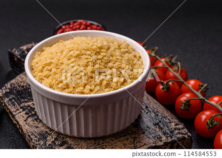 Raw stelline pasta from durum wheat with salt and spices Raw stelline pasta from durum wheat with salt and spices 114584553