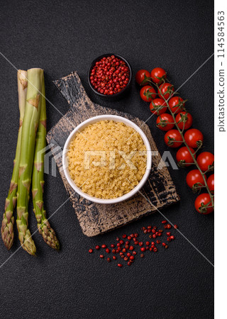 Raw stelline pasta from durum wheat with salt and spices Raw stelline pasta from durum wheat with salt and spices 114584563