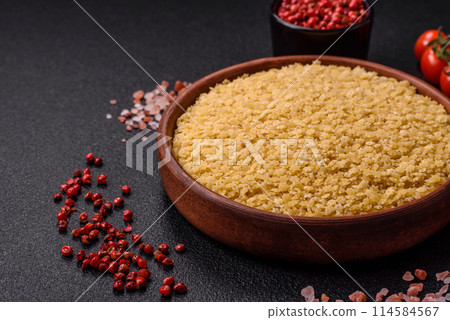 Raw stelline pasta from durum wheat with salt and spices Raw stelline pasta from durum wheat with salt and spices 114584567