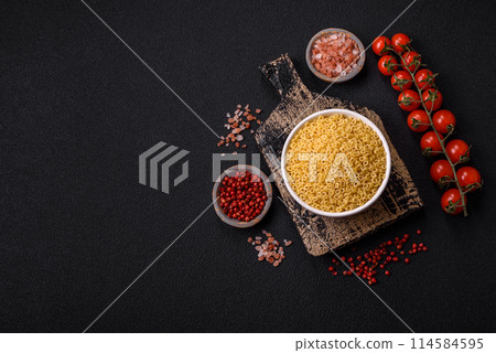 Raw anellini pasta from durum wheat with salt and spices Raw anellini pasta from durum wheat with salt and spices 114584595