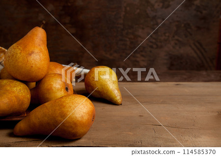 Pears on wooden background as background image.. 114585370