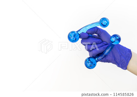 Mockup Human Gloved Hand Holds Blue Acrylic Back, Leg, Neck Massage Tool. Deep Tissue Massage, Thumb Massager with Knobs for Gentle Point, Muscles Relaxation. Design, Copy Space.Horizontal Mockup Human Gloved Hand Holds Blue Acrylic Back, Leg, Neck Massage Tool. Deep Tissue Massage, Thumb Massager with Knobs for Gentle Point, Muscles Relaxation. Design, Copy Space.Horizontal 114585826