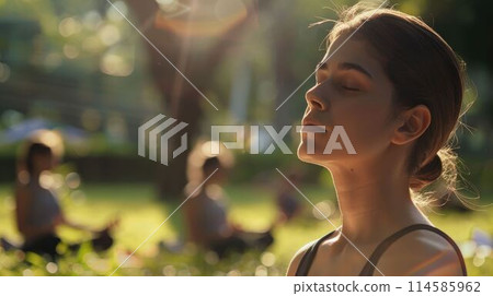 The person is meditating at the park with calm under bright light of sun. AIG43. The person is meditating at the park with calm under bright light of sun. AIG43. 114585962