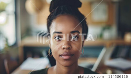The close up view african american female entrepreneur working in office. AIG43. 114586116