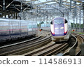 A Shinkansen train passing through Nasushiobara Station at high speed 114586913