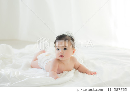 Baby wrapped in white cloth Baby wrapped in white cloth 114587765