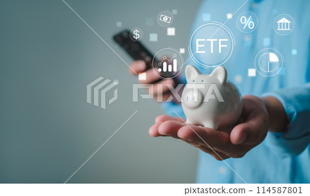 Man shows piggy bank Represents investment growth and shows icons of ETF Exchange traded fund stock market trading investment financial concept, Investment Opportunities in Mutual Funds and ETFs. Man shows piggy bank Represents investment growth and shows icons of ETF Exchange traded fund stock market trading investment financial concept, Investment Opportunities in Mutual Funds and ETFs. 114587801