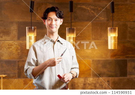 Portrait of a young male hair stylist Portrait of a young male hair stylist 114590931