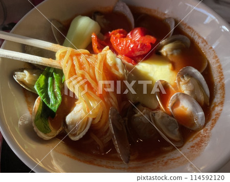 Clam Acquapazza Ramen with melted cheese in tomato soup Clam Acquapazza Ramen with melted cheese in tomato soup 114592120