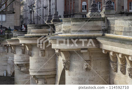 Round bastions which give it the look of a castle and ornate gargoyles are humorous, grotesque figures of dentists, pickpockets and loiterers on the Pont Neuf bridge. Round bastions which give it the look of a castle and ornate gargoyles are humorous, grotesque figures of dentists, pickpockets and loiterers on the Pont Neuf bridge. 114592710