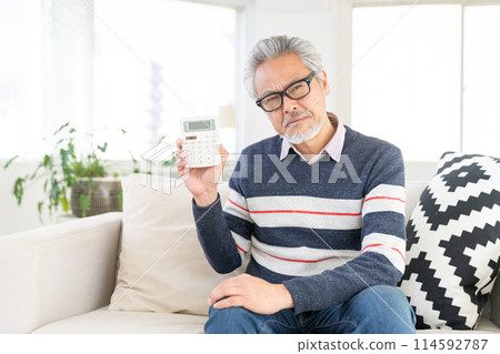 Senior male calculator think 114592787