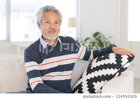 Senior man relaxing in the room 114592829
