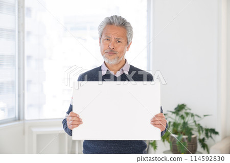 Senior man thinking on whiteboard Senior man thinking on whiteboard 114592830