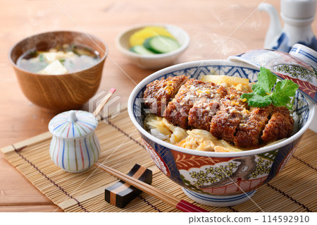 A Japanese meal set of hot katsudon and miso soup A Japanese meal set of hot katsudon and miso soup 114592910