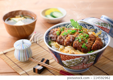 A Japanese meal set of hot katsudon and miso soup A Japanese meal set of hot katsudon and miso soup 114592962