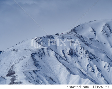The Northern Alps in mid-winter covered in clouds, Hakuba Village, Nagano Prefecture 114592964