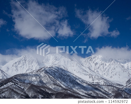 The Northern Alps in mid-winter covered in clouds, Hakuba Village, Nagano Prefecture 114592972