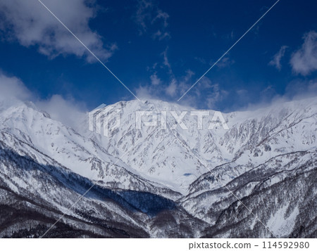 The Northern Alps in mid-winter covered in clouds, Hakuba Village, Nagano Prefecture 114592980