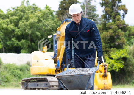 Workers working at a construction site Workers working at a construction site 114596265