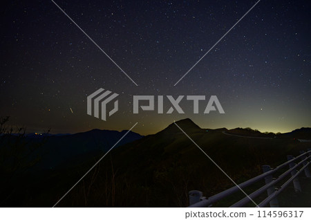 A quiet night view with a starry sky and mountain silhouettes A quiet night view with a starry sky and mountain silhouettes 114596317