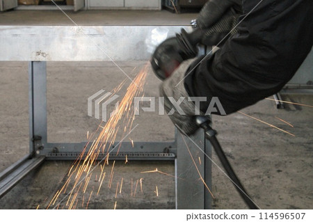 Heavy industry factory worker welding metal construction. Craftsman cutting steel production. Welder working in workshop. Master processing in plant. Industrial safety concept. 114596507