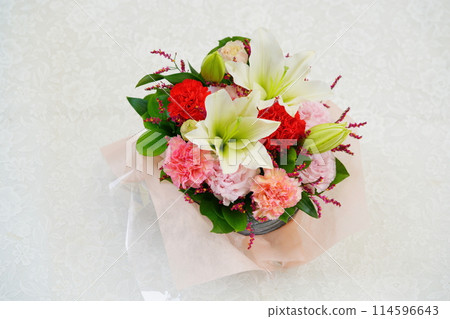 Mother's Day gift flower arrangement on white background Mother's Day gift flower arrangement on white background 114596643