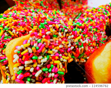 Colorful chocolate-covered donuts Colorful chocolate-covered donuts 114596782