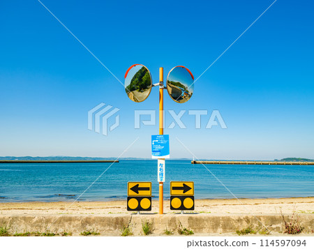 Convex mirror on the road with a view of the ocean, Teshima, Kagawa Prefecture, Travel 114597094