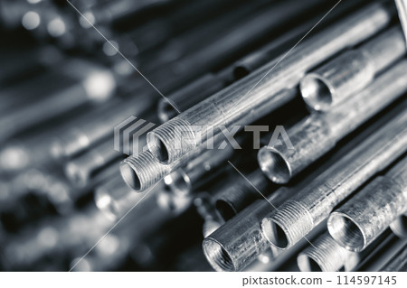 metal gas pipe store stack pile on shelf black and white vintage color tone. watering pump sewer system industry equipment 114597145