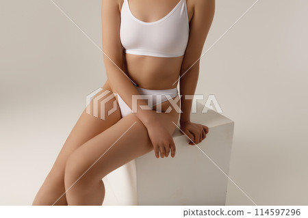 Cropped image of female body, breast in white 114597296