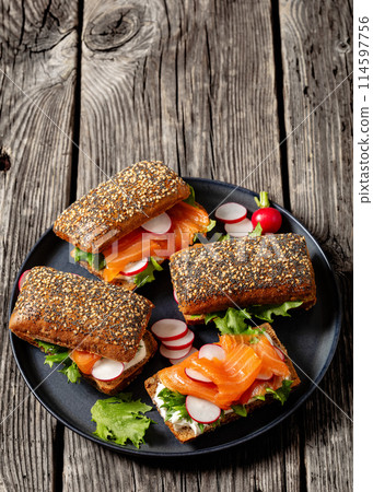 smoked salmon sandwiches on rye bread rolls 114597756